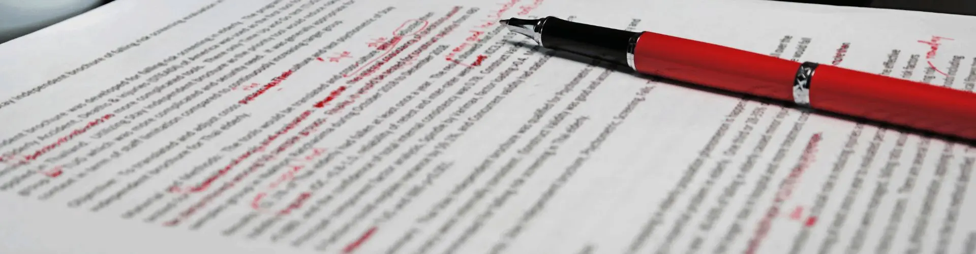 Doctoral candidate reviewing an edited dissertation chapter with tracked changes